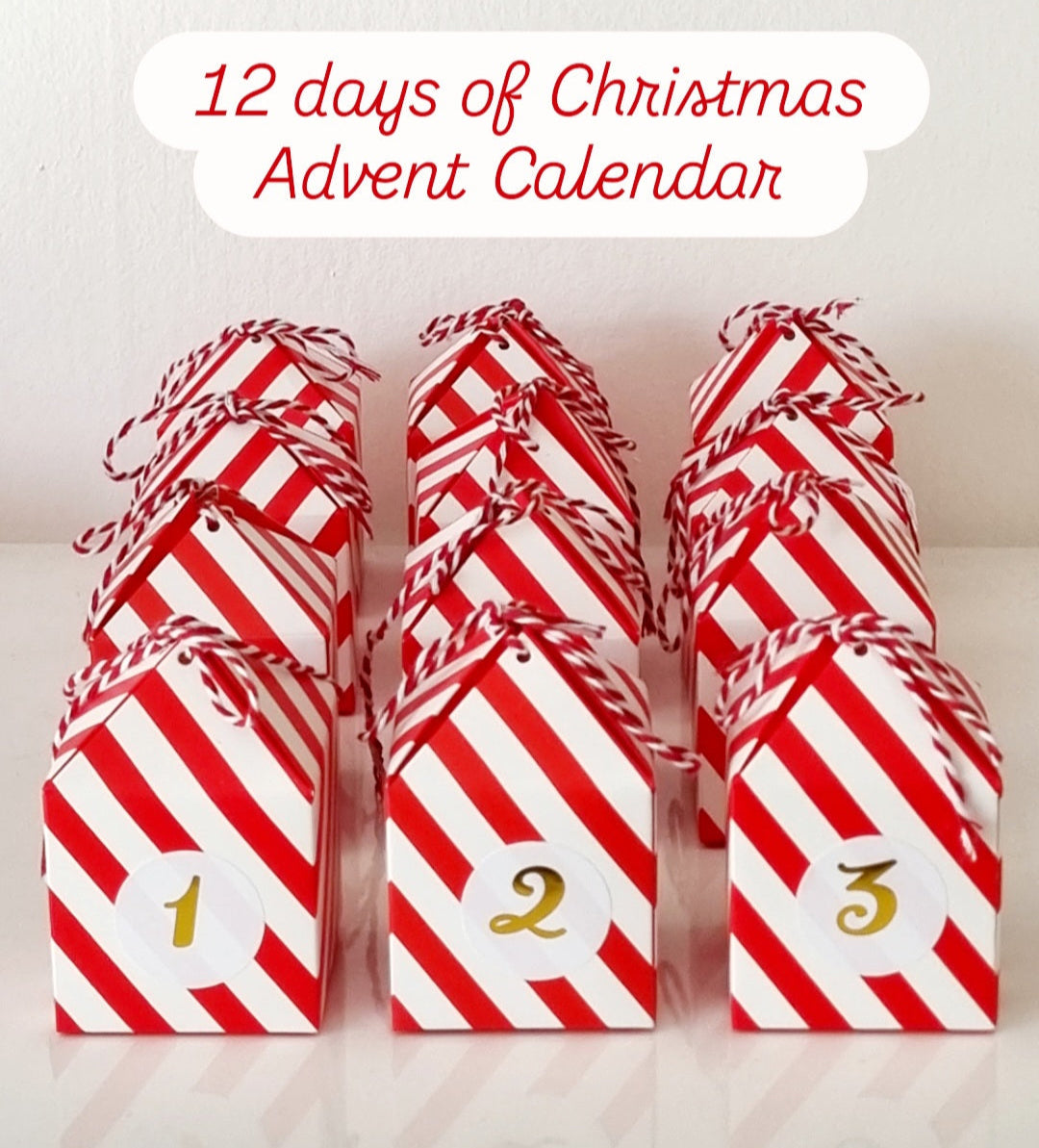 Red and white striped boxes with numbers, labeled '12 days of Christmas Advent Calendar'.